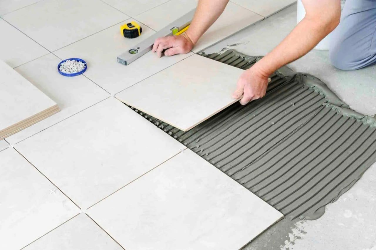 Laying tiles over tiles
